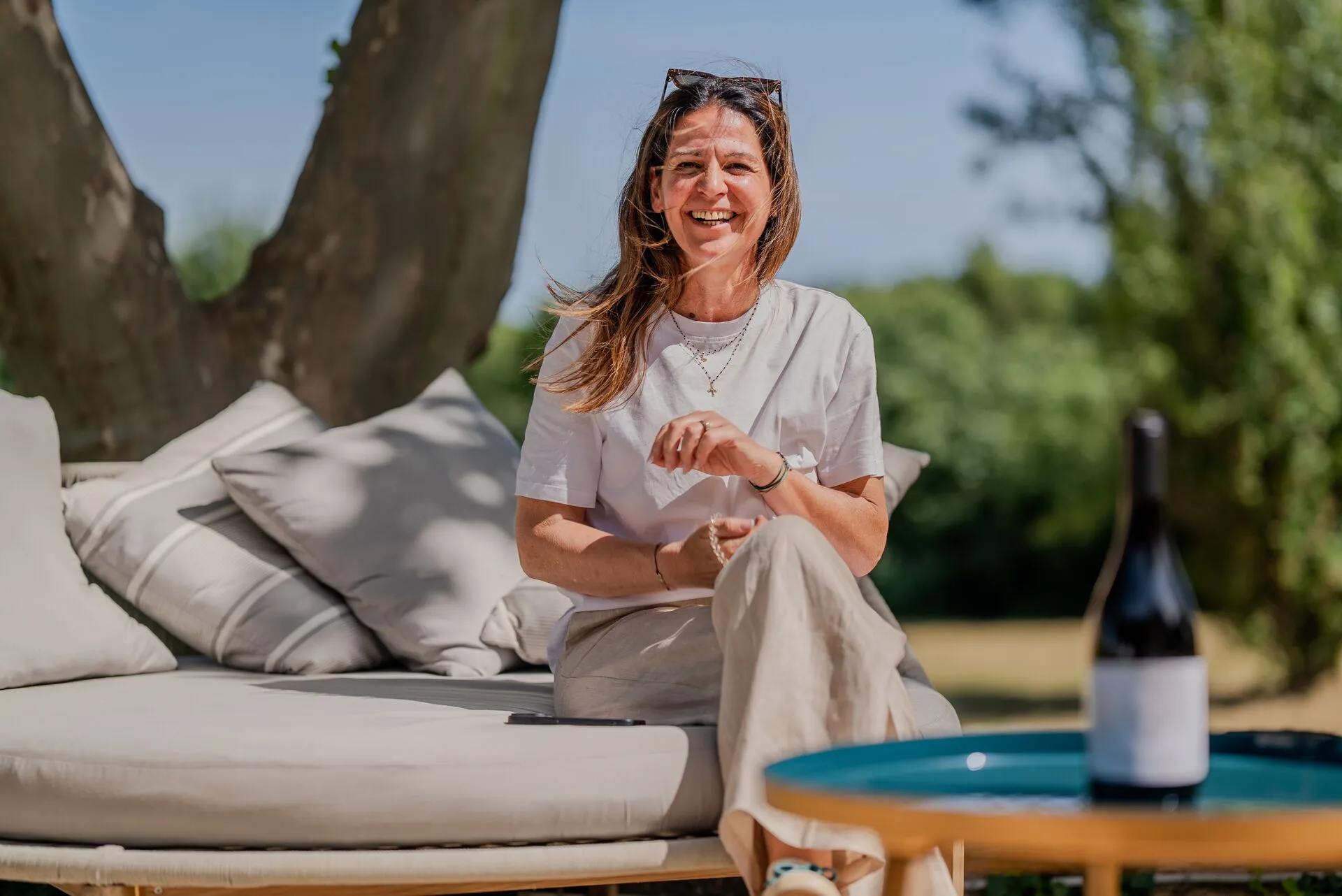 Carine Pichot, winegrower at Domaine de Fabrègues, sitting on a terrace